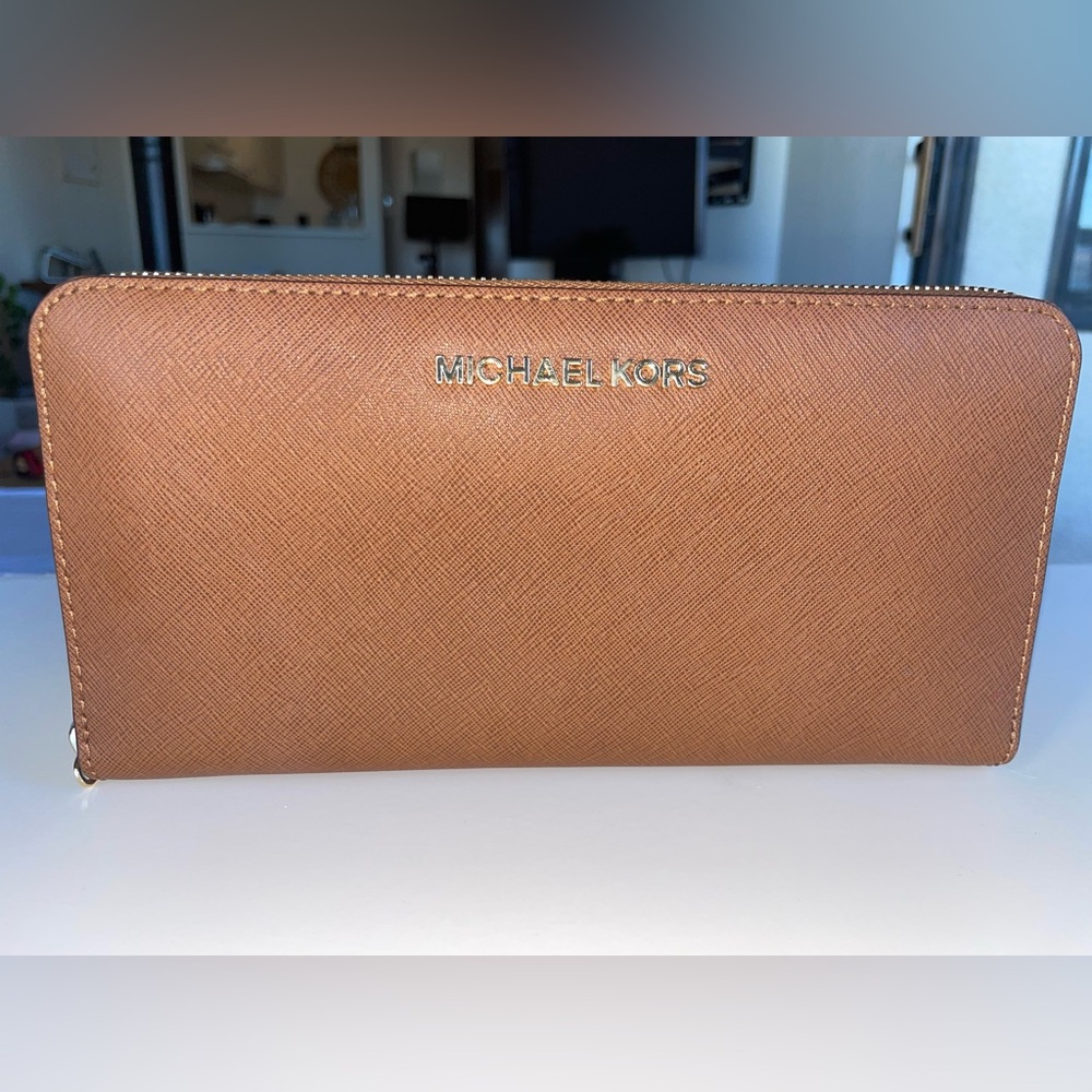 Michael Kors camel colored clutch/wallet.